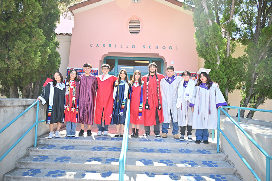 Group photo outside Carrillo of alumni students in their caps and gowns