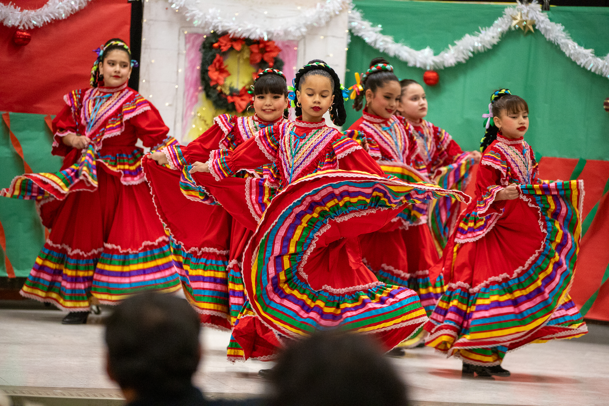 Girls dance in red folklorico dresses