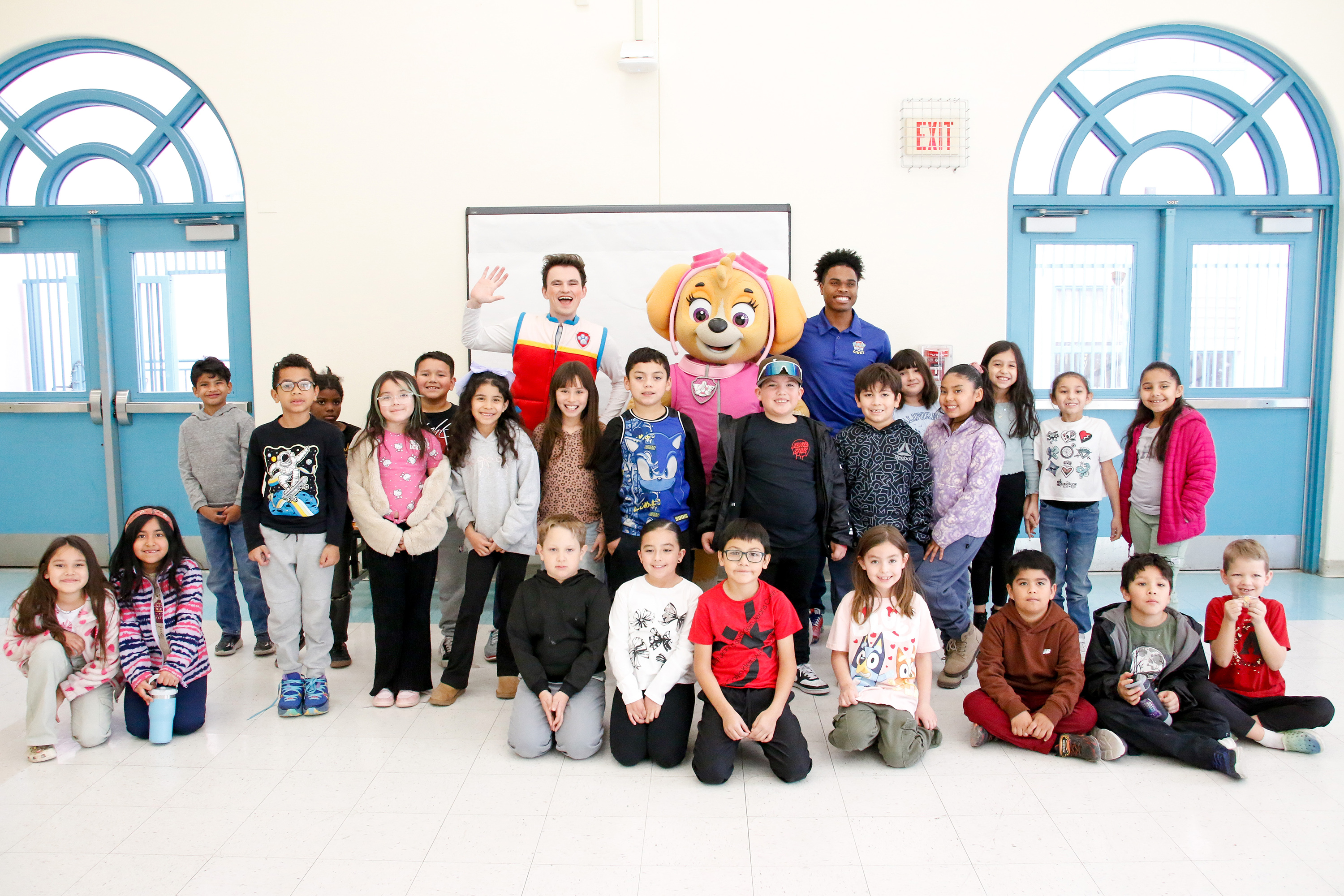 A PAW Patrol group photo with students