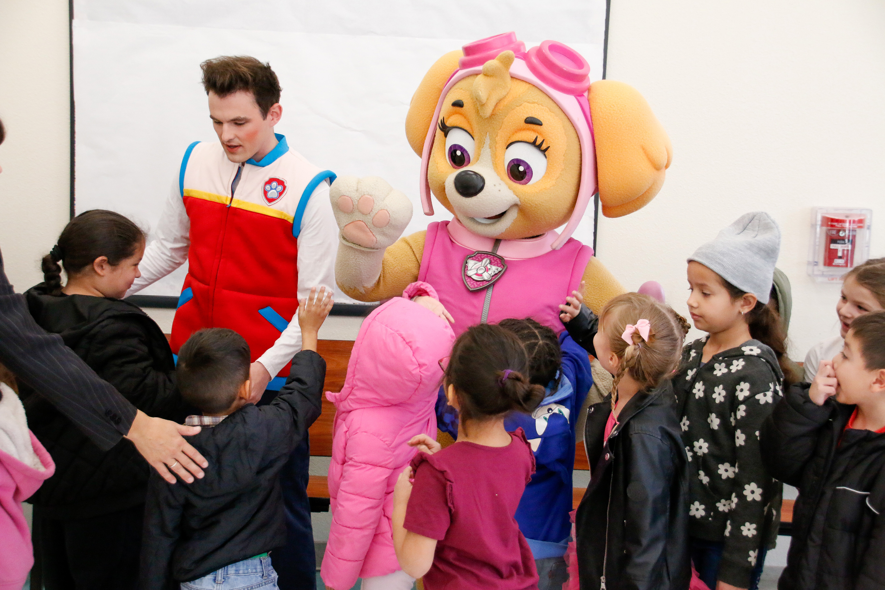 Skye the dog greets students