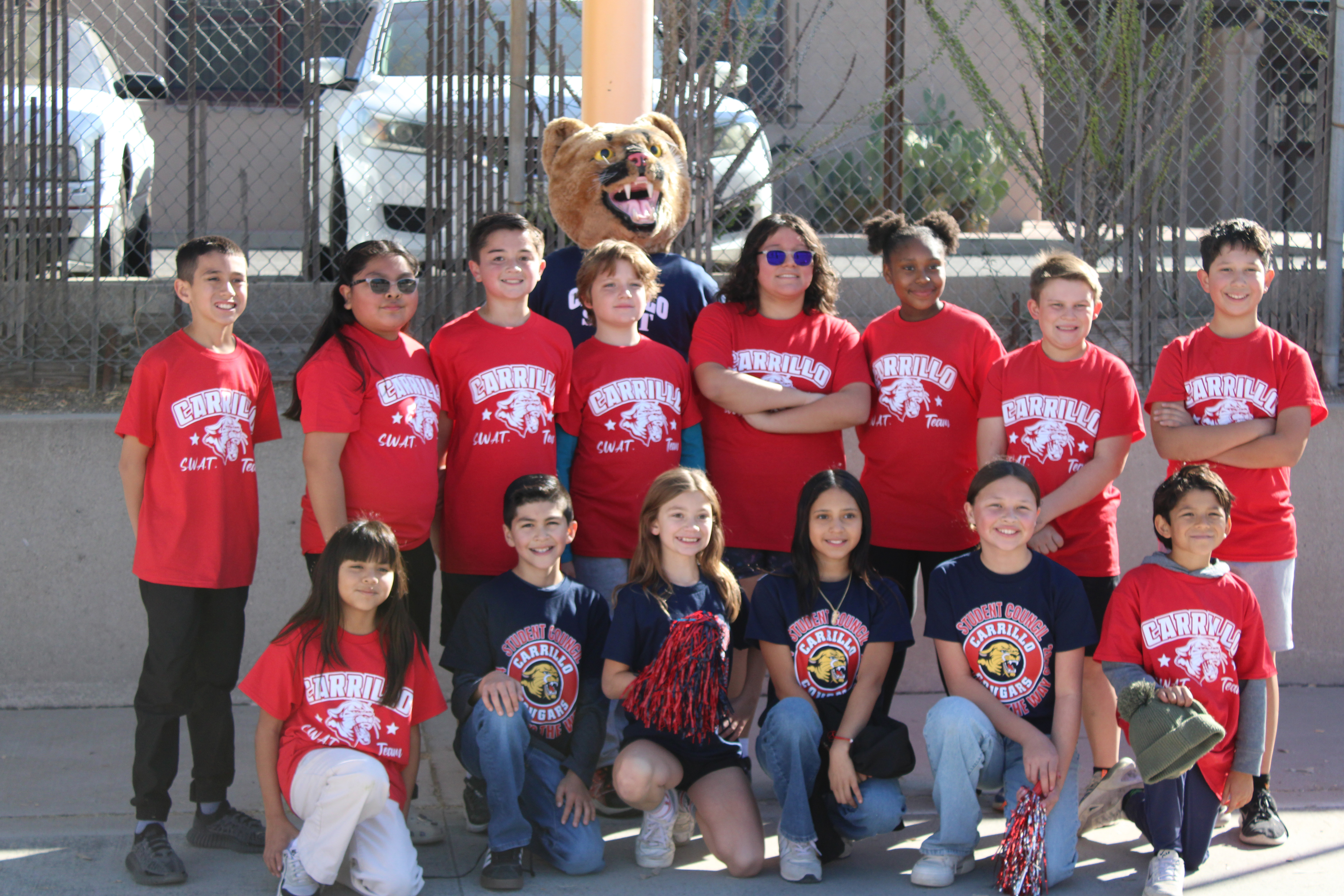 A group of students pose in their Carrillo shirts