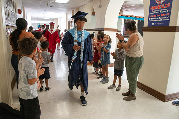 High school grads walk through Carrillo's halls