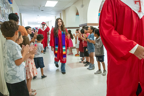 High school grads walk through Carrillo's hallways