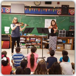 students playing violins